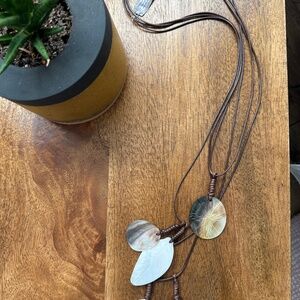 Necklace with mother of pearl look accents